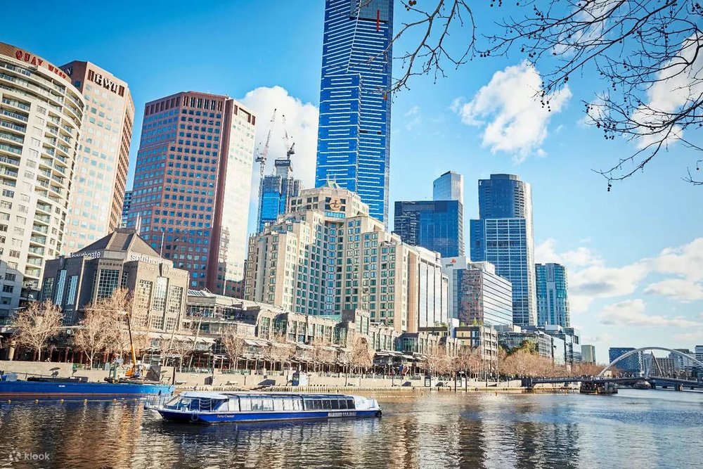 A cruise going down the Yarra River with the Melbourne CBD as its backdrop