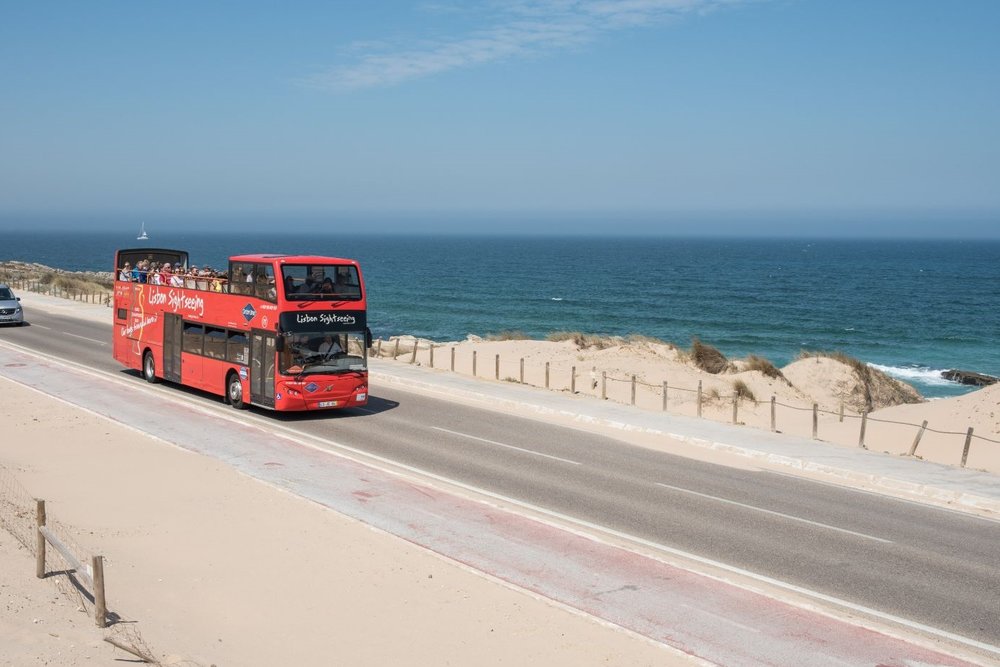 Lisbon HoHo Tour bus along the coast