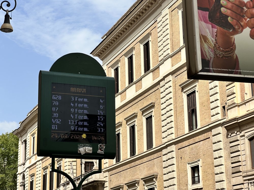 rome live bus time timetable outside pubic rome transit stop in the center of the city