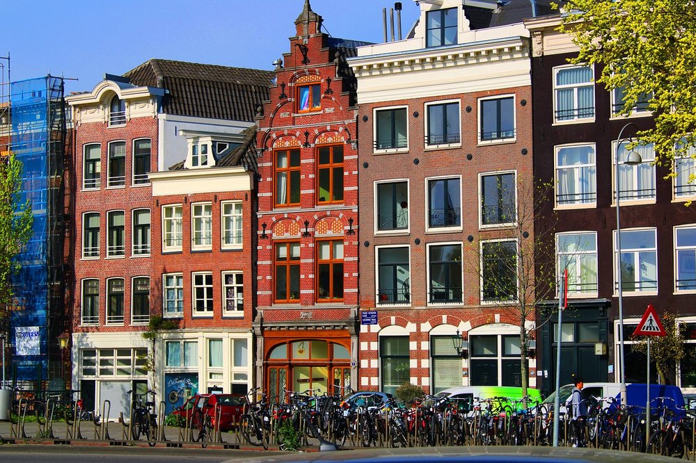 Townhouses in Amsterdam during a sunny day in spring.