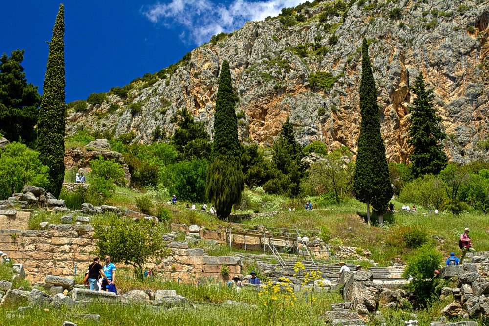 Tourists walking around nature in Delphi 
