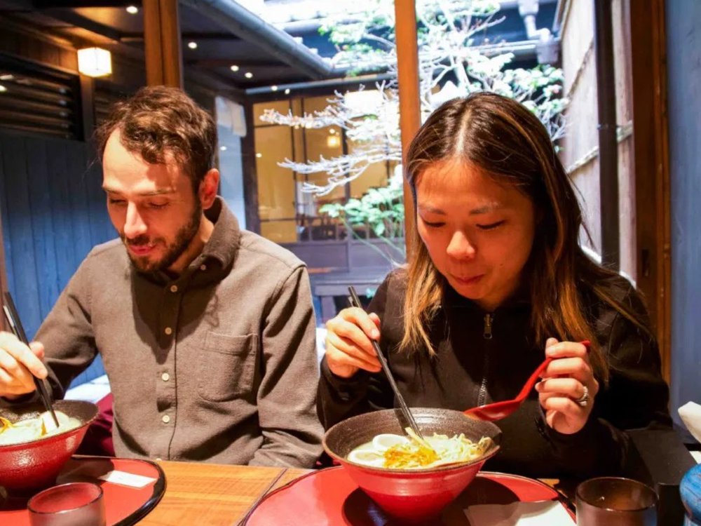 Two people eating ramen in Kyoto