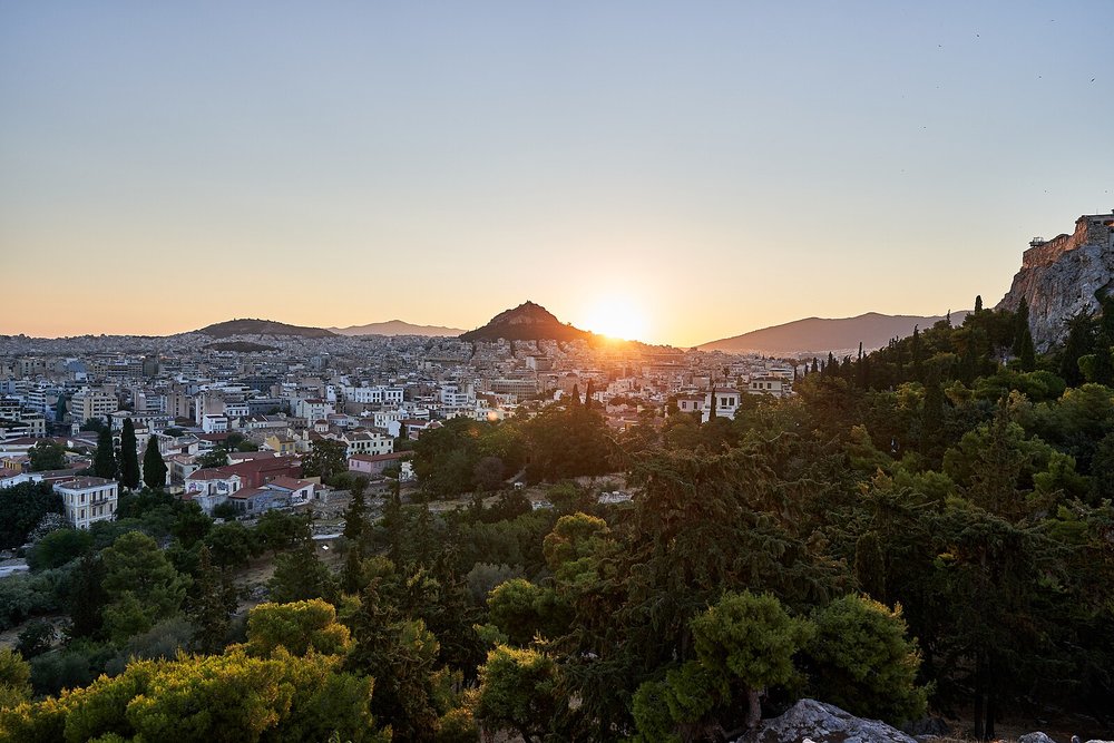 Athens skyline with Mount Lycabettus at sunset seen from Areopagus