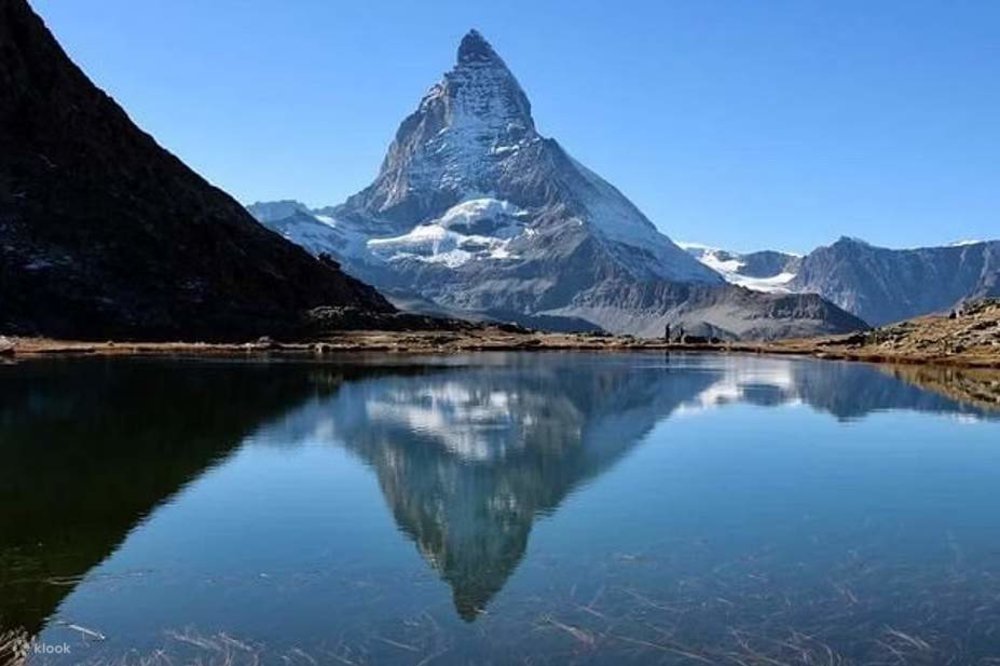 A photo of Matterhorn, foregrounded by a body of water