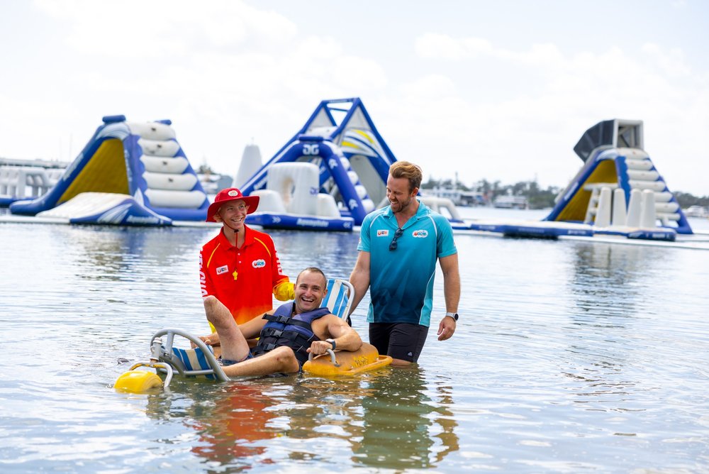 Guests and staff enjoying the floating obstacle course at GC Aqua Park