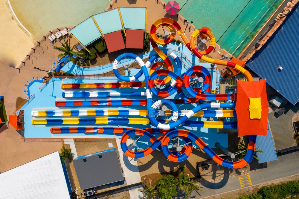 Bright looping water slides at WhiteWater World seen from above