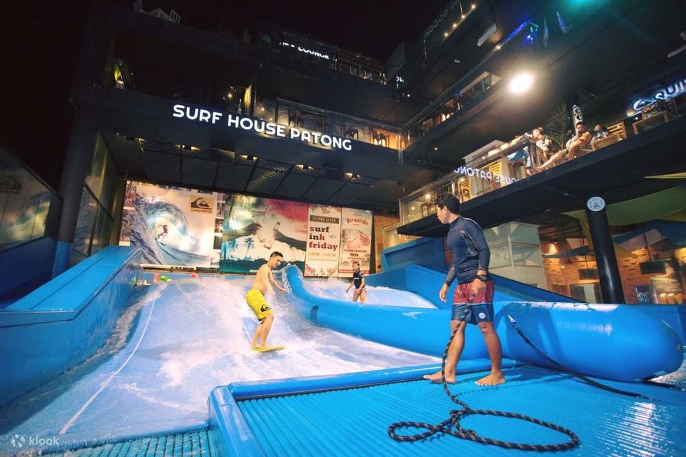 A man taking a surfing lesson at Surf House Patong.