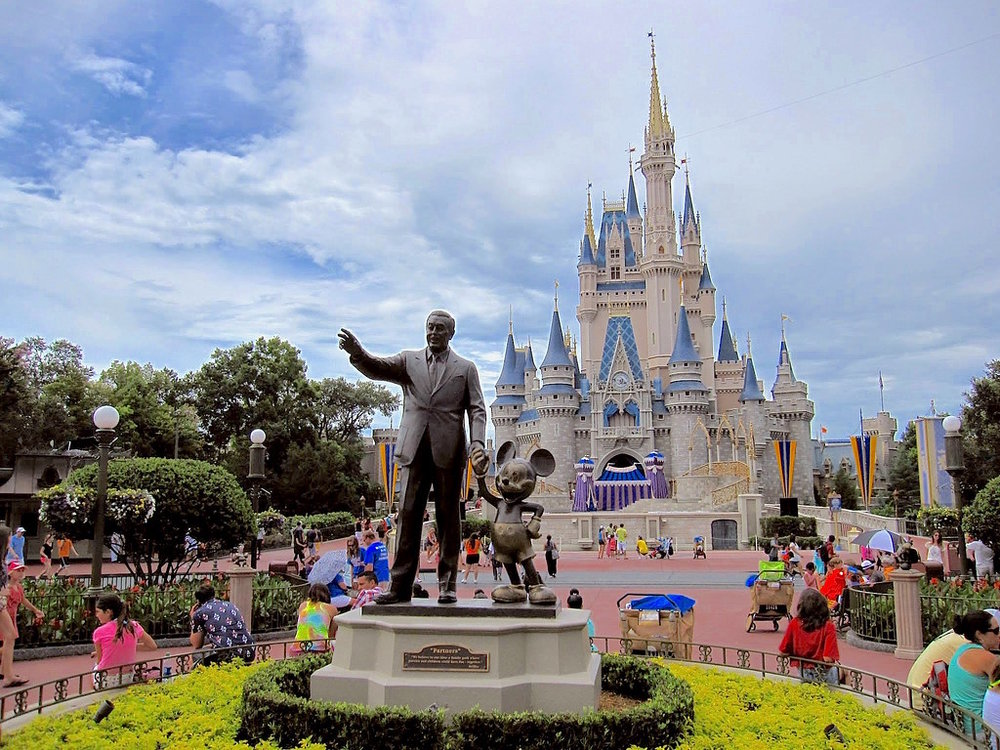 Partners statue featuring Walt Disney and Mickey Mouse, with the Cinderella Castle in the background