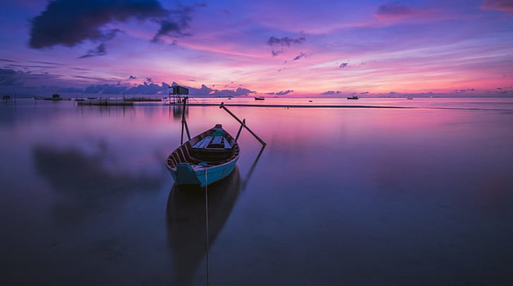 A picture of a couple on the beach during the sunset at Phu Quoc.