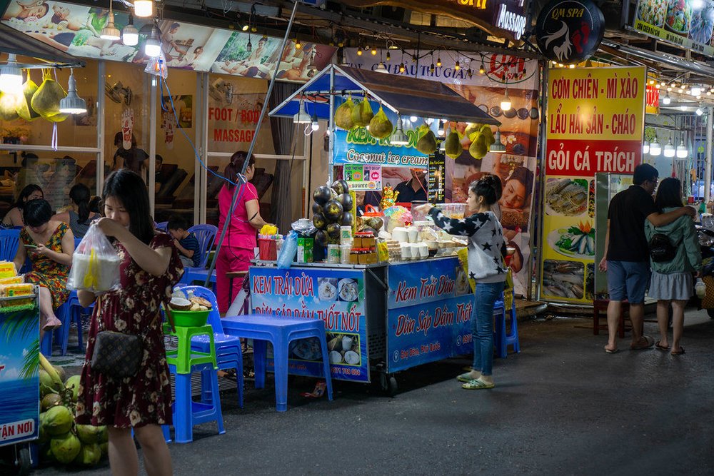 A night street market scene in Vietnam.