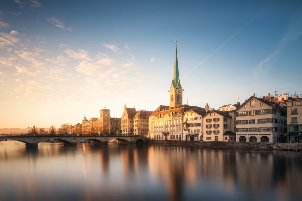 Sunset view of Zurich Old Town and Limmat River with historic buildings