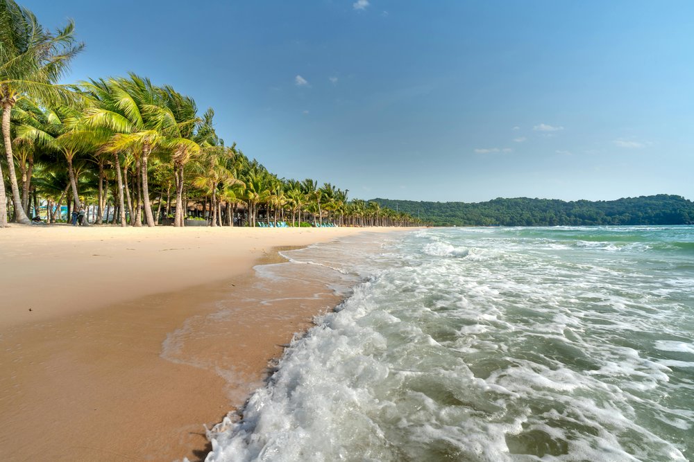 Wide sandy shoreline and palm trees at Long Beach Phu Quoc