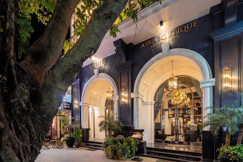 Aira Boutique Hanoi Hotel & Spa exterior with elegant lighting at night