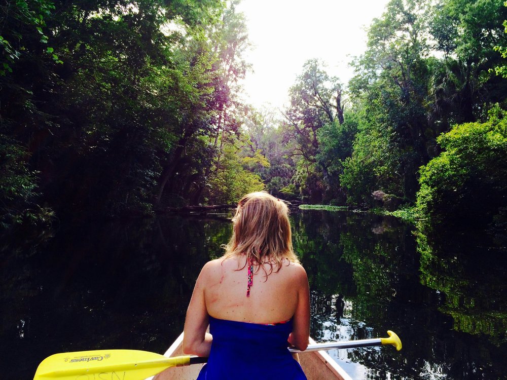 Person canoeing along the Wekiwa River