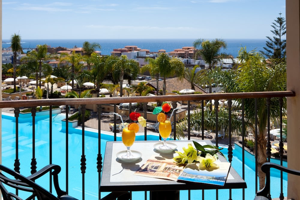 Take in the dazzling view of the pool and see from your balcony