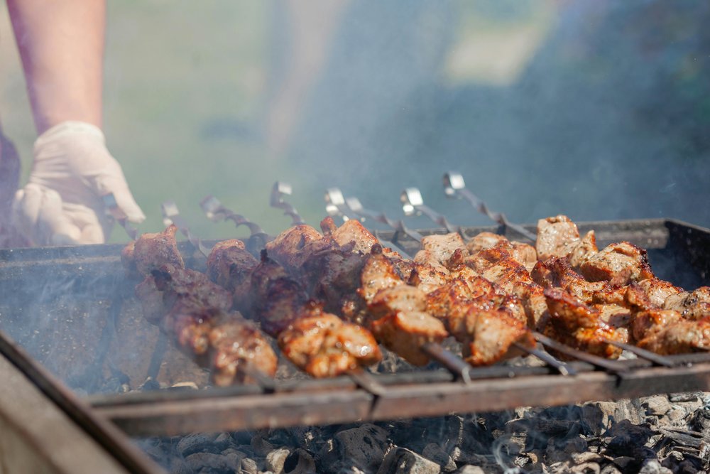 Pork skewers on a grill