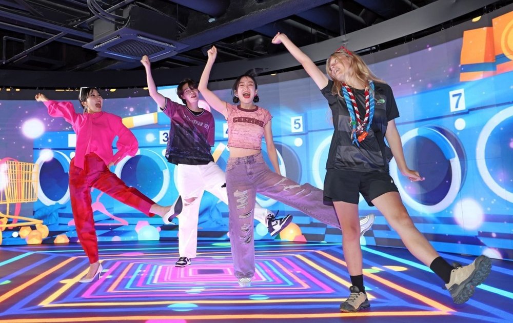 Travelers enjoying an interactive indoor activity in Seoul