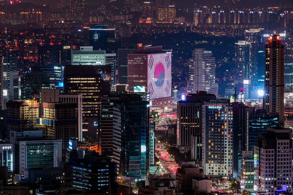 Night view of Seoul city skyline with illuminated buildings
