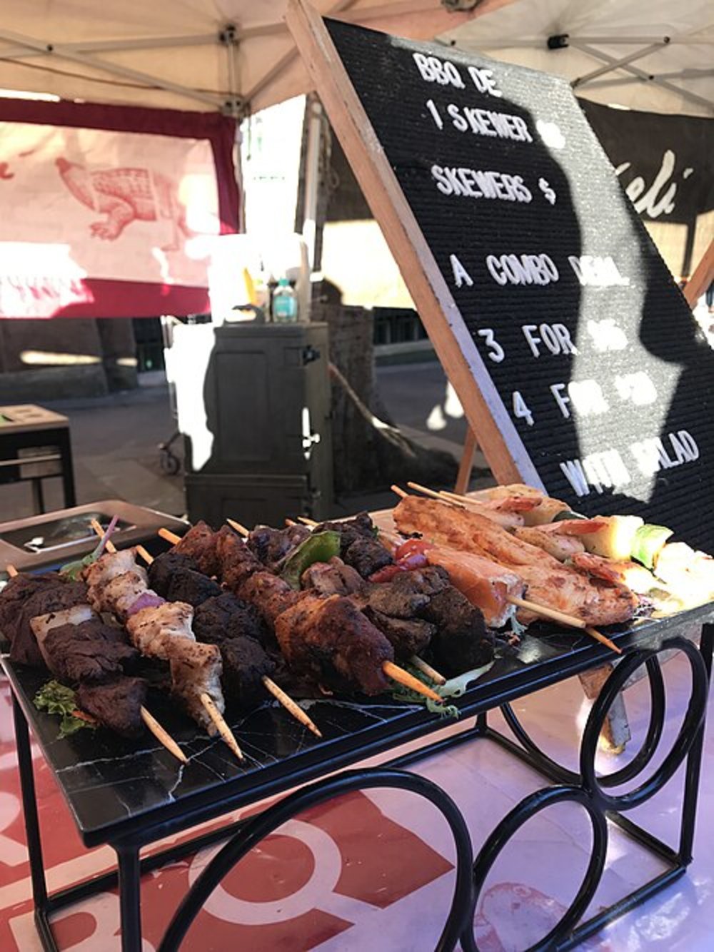 Street food stall in Sydney selling grilled skewers and affordable takeaway food
