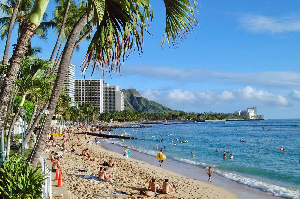 People sunbathing at Kaimana Beach