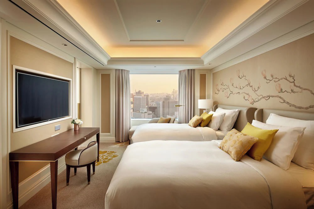 Lotte Hotel Seoul guest room with city skyline views