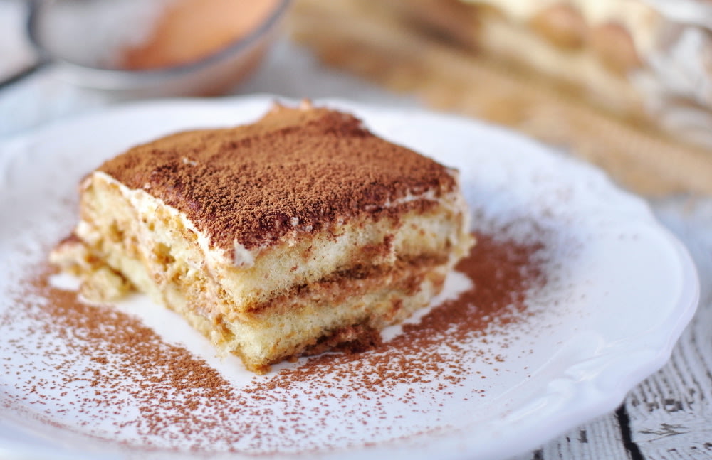 A square slice of tiramisù on a plate