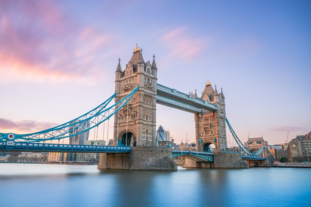 Tower Bridge in London with blue suspension beams over the River Thames