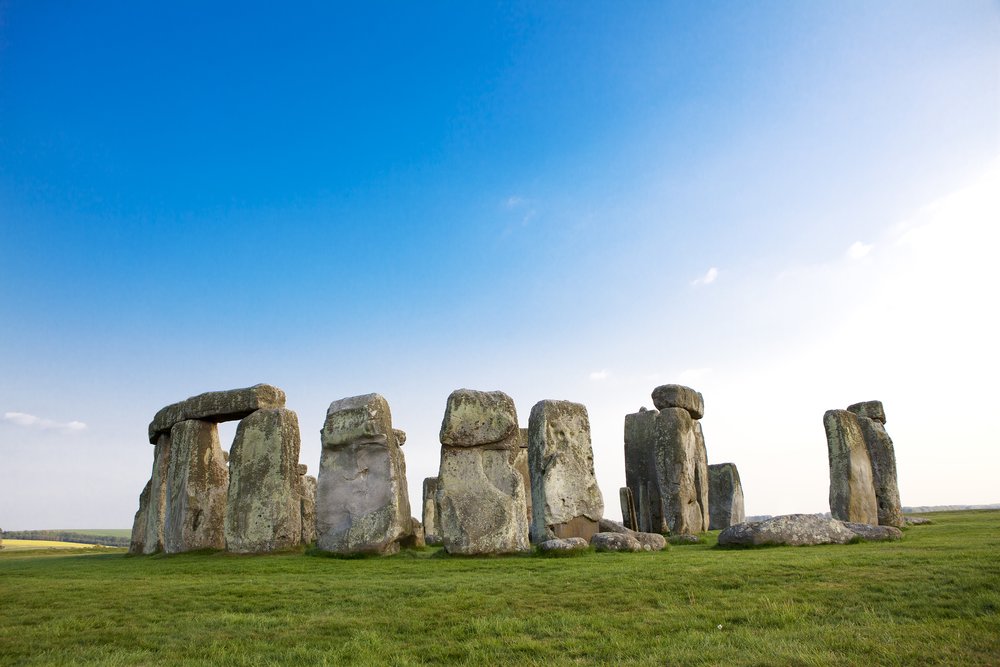 Stonehenge stone circle under a clear blue sky in southern England