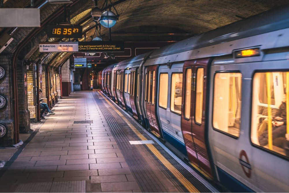 London Tube train at underground station with historic platform