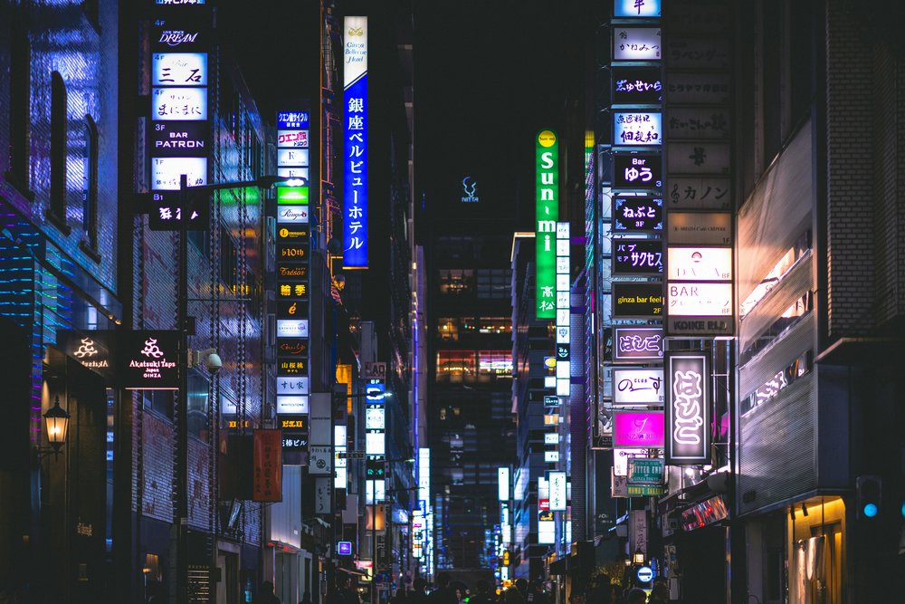 Neon-lit Ginza street at night in Tokyo