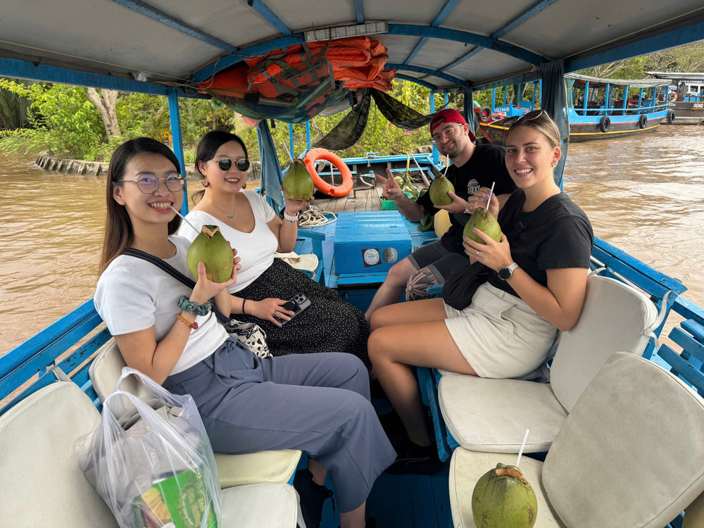 Enjoying a coconut at Mekong Delta River Cruise