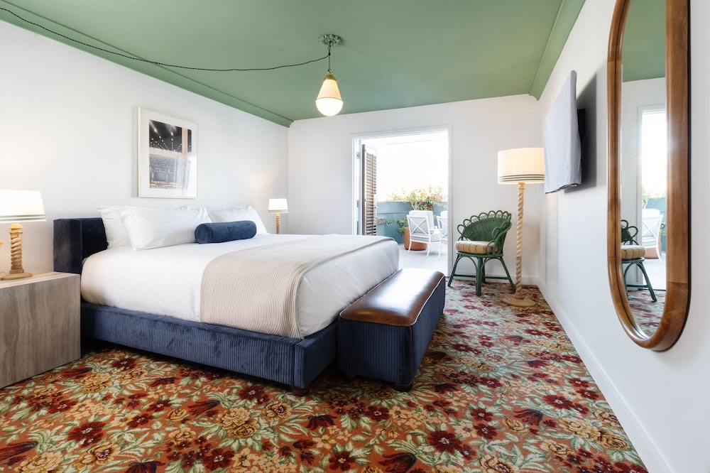Boutique hotel room in Los Angeles with colorful carpet and outdoor seating