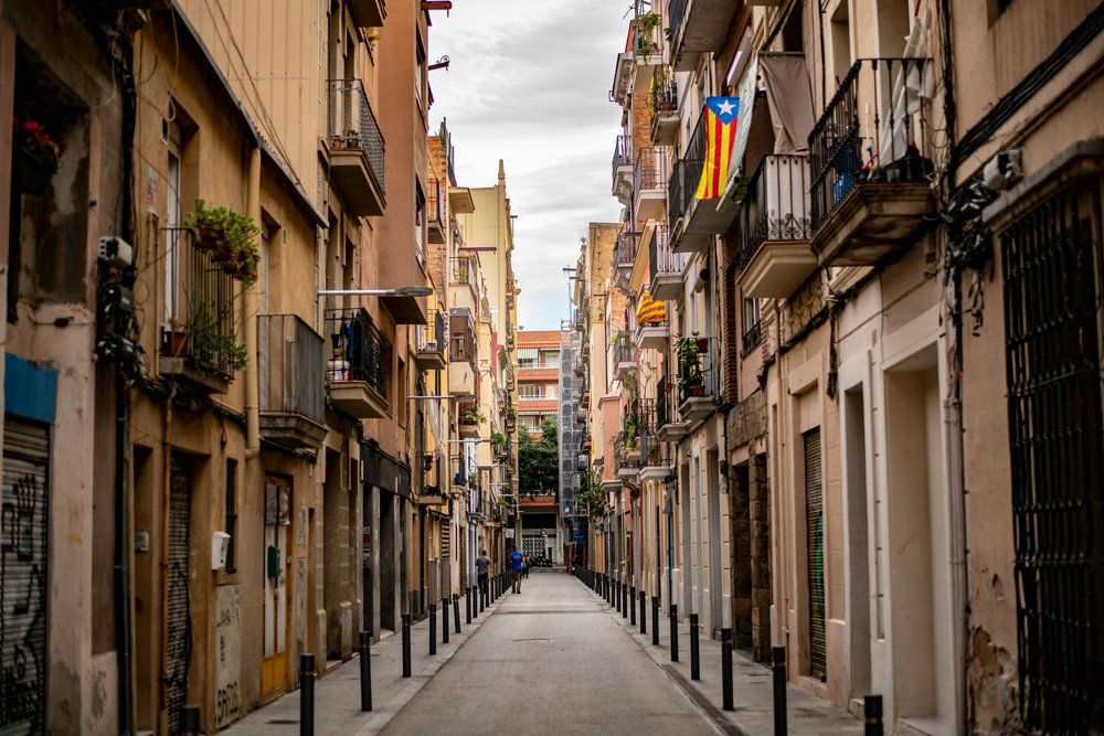 View of an alley between residential buildings in the Gothic Quarter | Photo Credit: Samuel Sweet on Unsplash