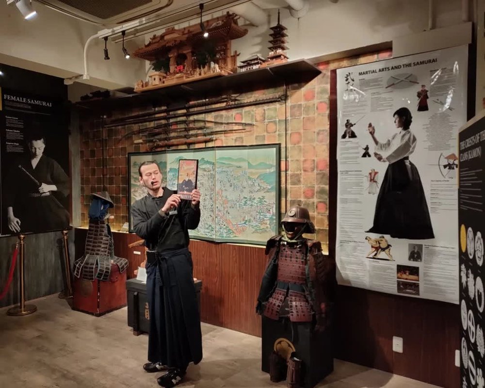 Instructor teaching about the history of Samurai in Samurai Ninja Museum Kyoto
