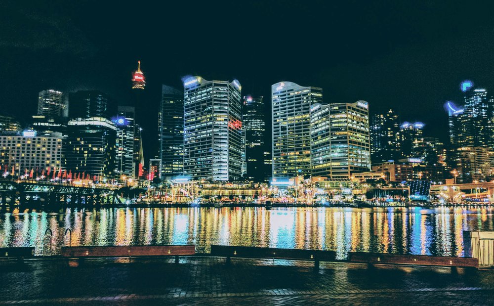 Night view of Darling Harbour skyline reflected on the water in Sydney