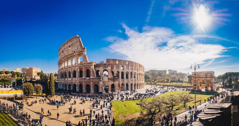 Colosseum in Rome with crowds exploring the ancient Roman amphitheater