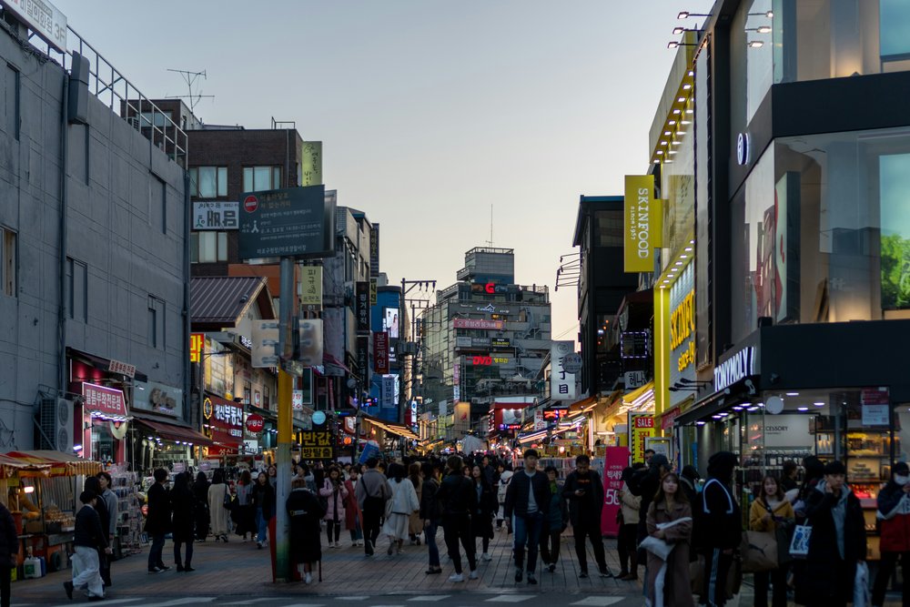 Crowded Hongdae street with shops cafés and nightlife atmosphere in Seoul