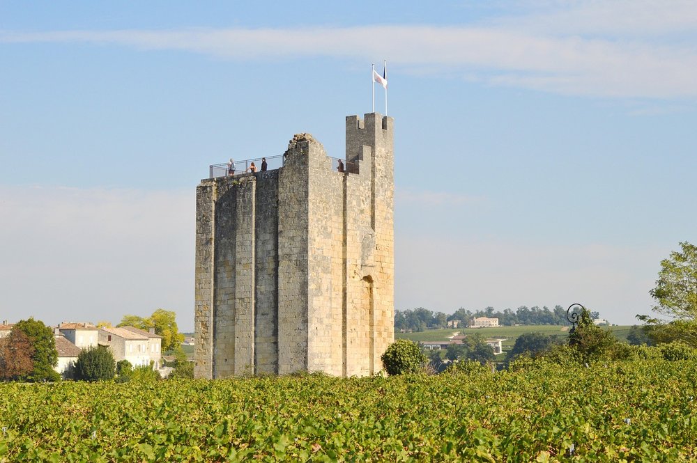 A medieval landmark in Saint Émilion, surrounded by vineyards.