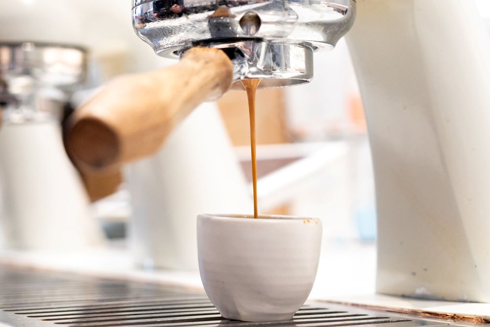 Fresh espresso being poured into a cup at a Melbourne café