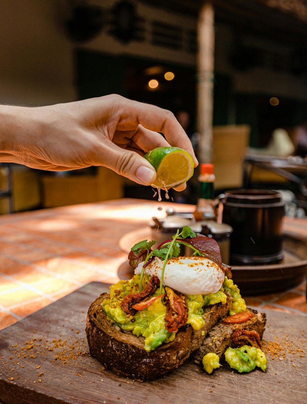 Smashed avocado toast topped with a poached egg at a Melbourne café