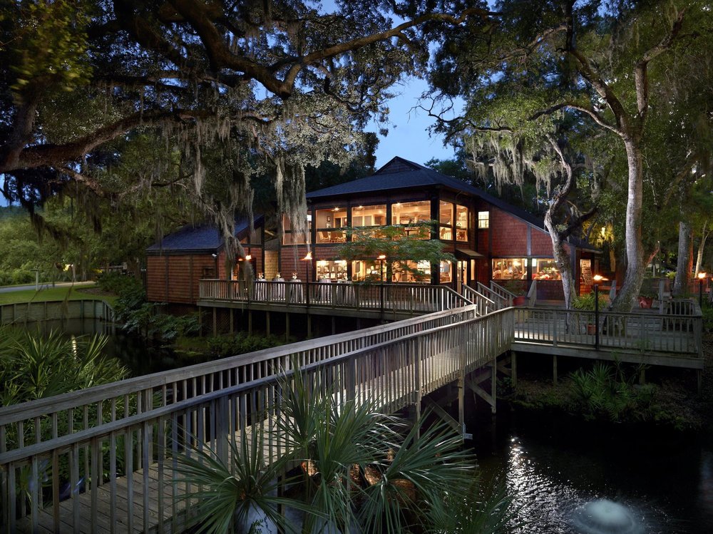 Omni Amelia Island Resort with wooden walkways and lush trees at dusk