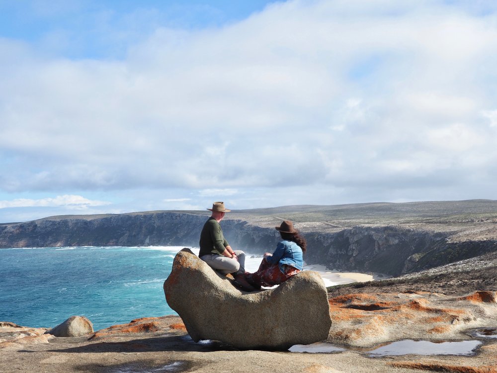 Couple overlooking dramatic cliffs and ocean views on Kangaroo Island, South Australia