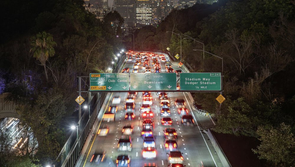 Los Angeles freeway traffic, cars packed bumper-to-bumper near downtown exits | Photo from Soly Moses on Pexels