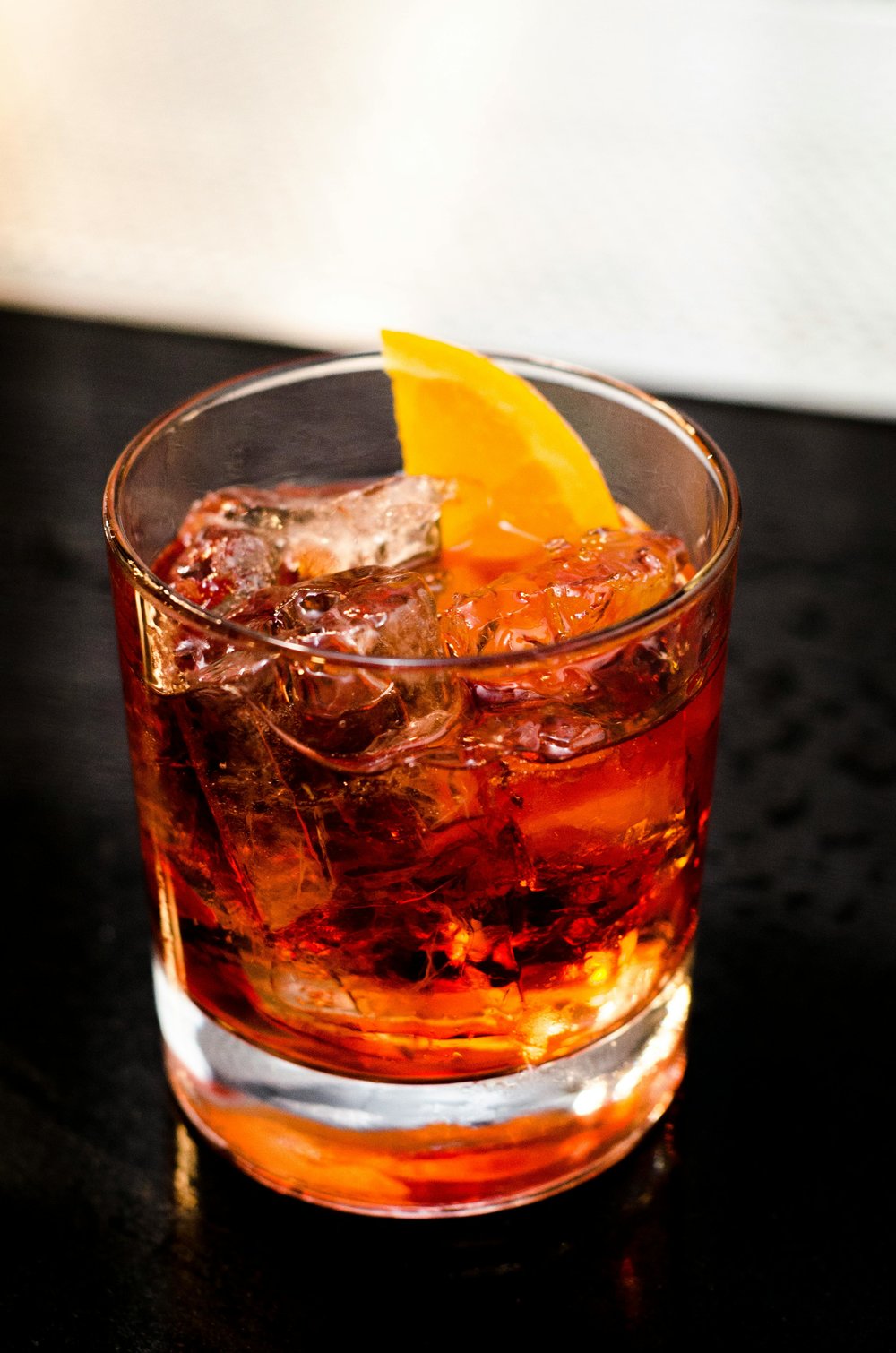 Negroni cocktail with orange peel at a local Barcelona bar