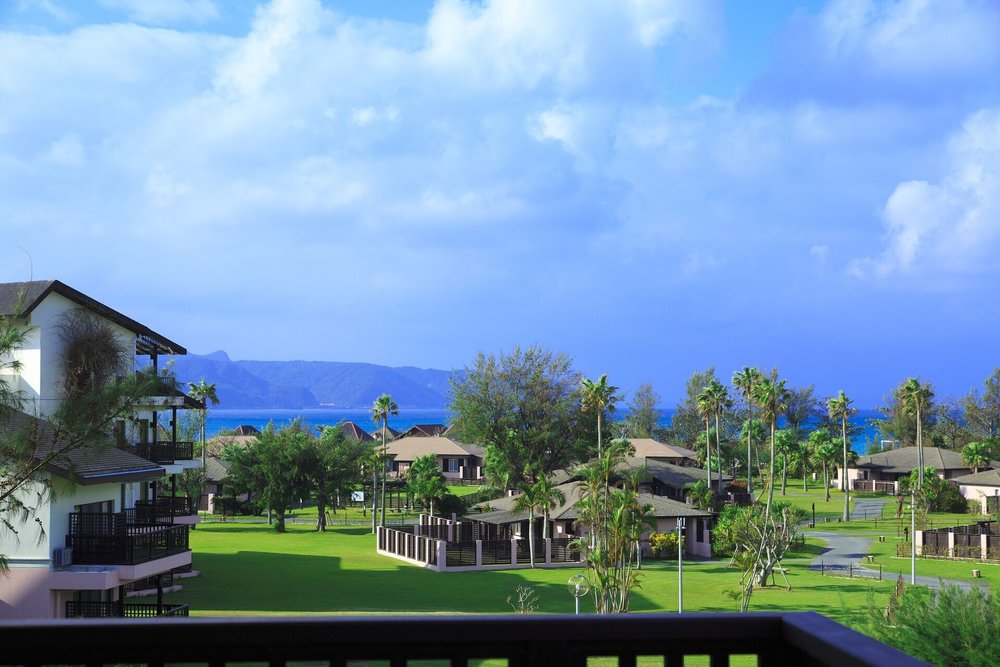 Cottage-style resort surrounded by greenery at Okuma Private Beach & Resort
