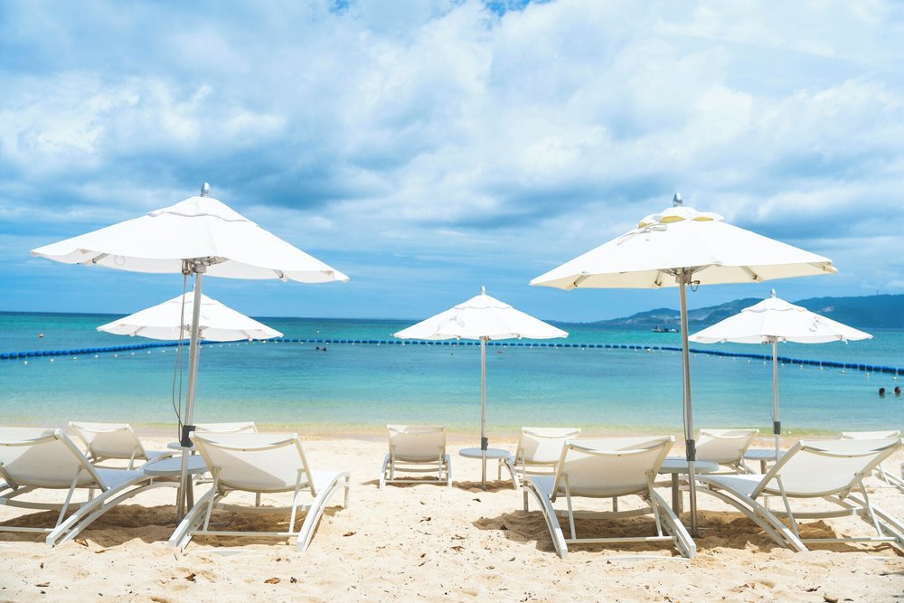White sand beach and sun loungers at Halekulani Okinawa