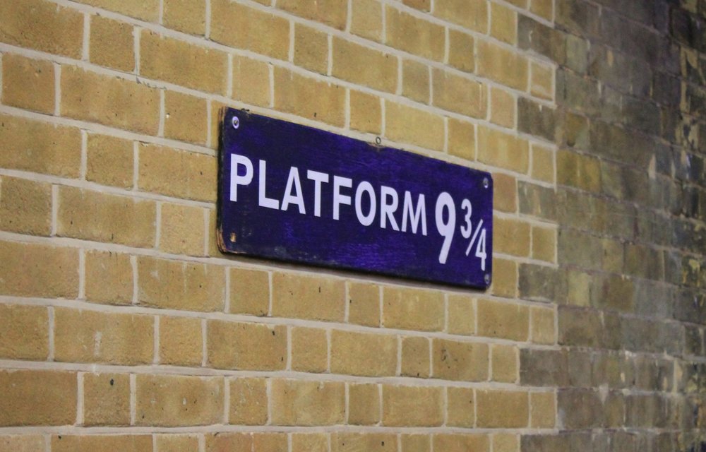 A blue sign that says “Platform 9 ¾”