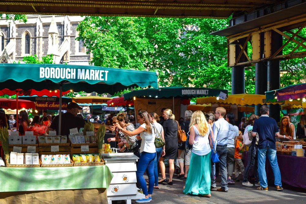 A crowd of people looking at market stalls. Photo by Mark Dalton via Pexels