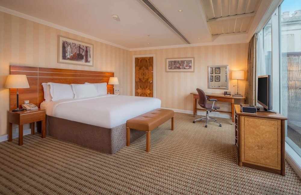 Hotel room at Hilton London Paddington with work desk and seating
