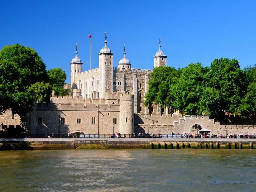 The Tower of London along the River Thames on a sunny day
